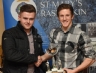 Aodhan Hardy presents Tiarnan Doherty with the Christy Hardy Trophy for Most Improved Footballer.